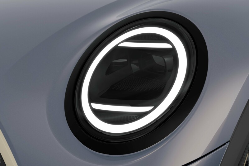 Der Frontscheinwerfer eines MINI Cooper Cabrios in der Farbe Copper Grey metallic